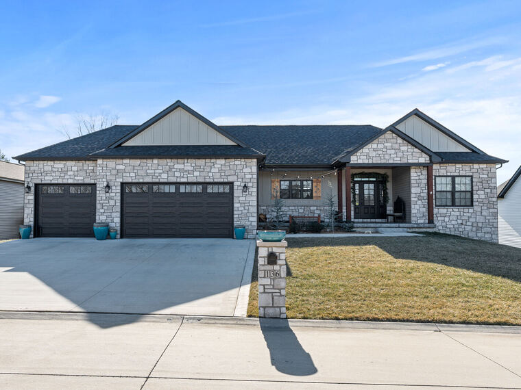 Stone ranch home with three-car garage